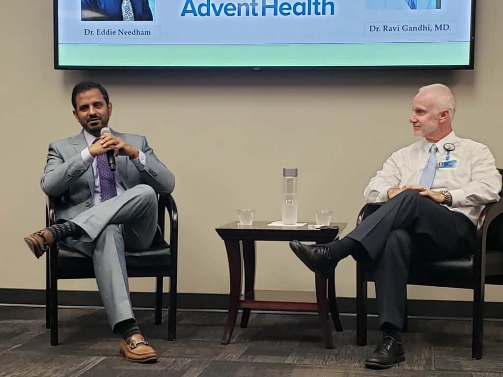 Dr. Ravi Gandhi and Dr. Eddie Needham speak during National Stroke Awareness Month event in May