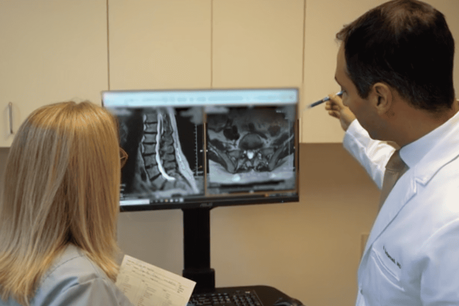 Dr. Sadrameli examining xray or mri with madical assistant